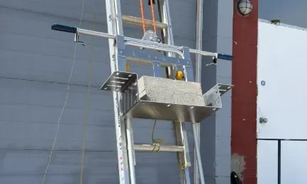 CarryALL tray carrying a ballast block up the ladder